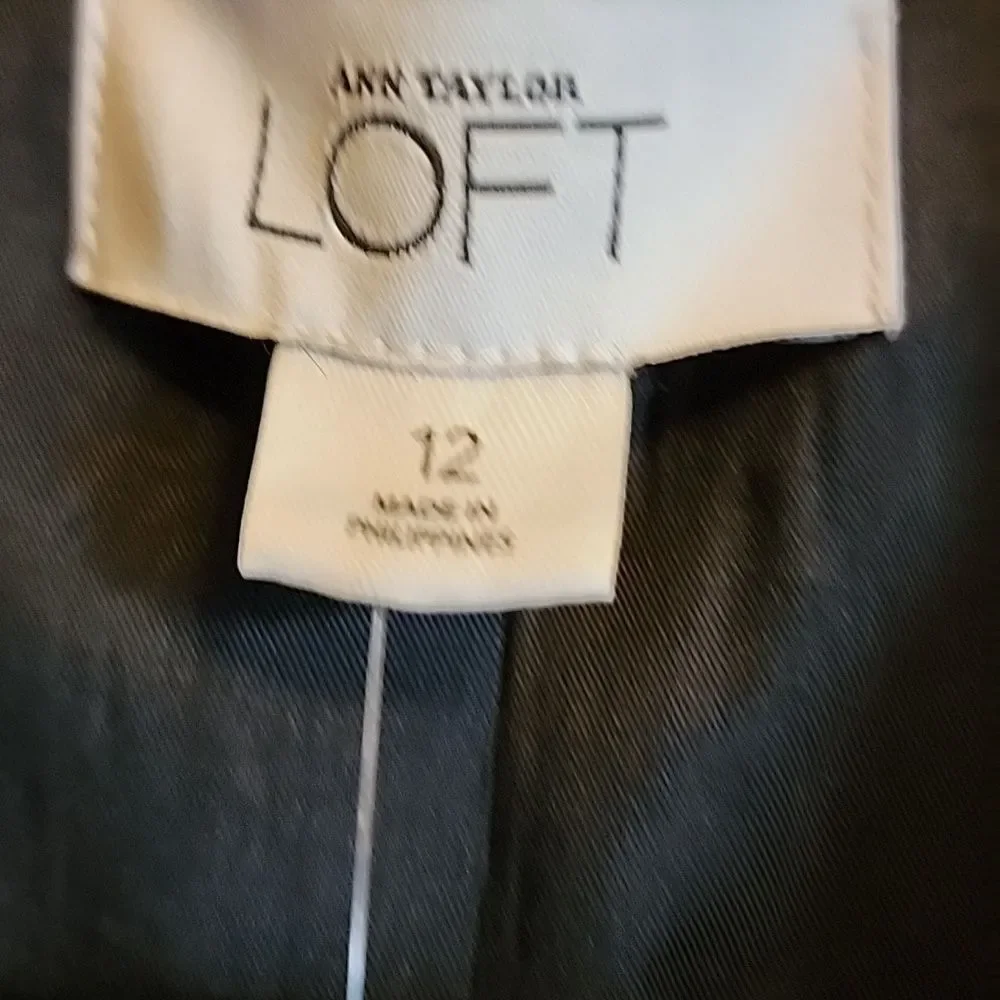 Loft-wool very light blk short blazer with peplum in back Size 12 NWT.